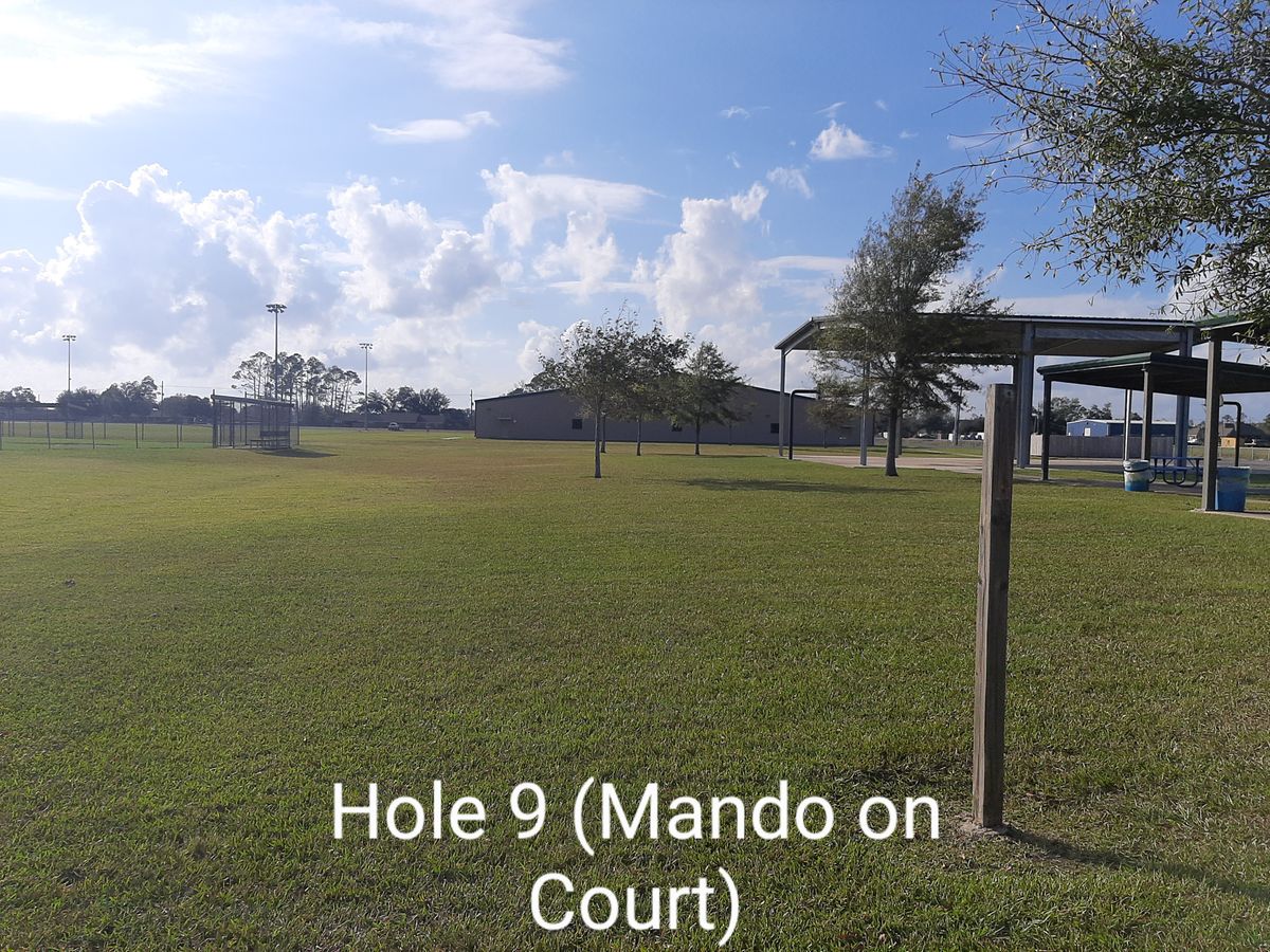 Southeast pole of basketball court mando. All sidewalks and baseball fields OB. Drop at corner of basketball court (mando pole)
