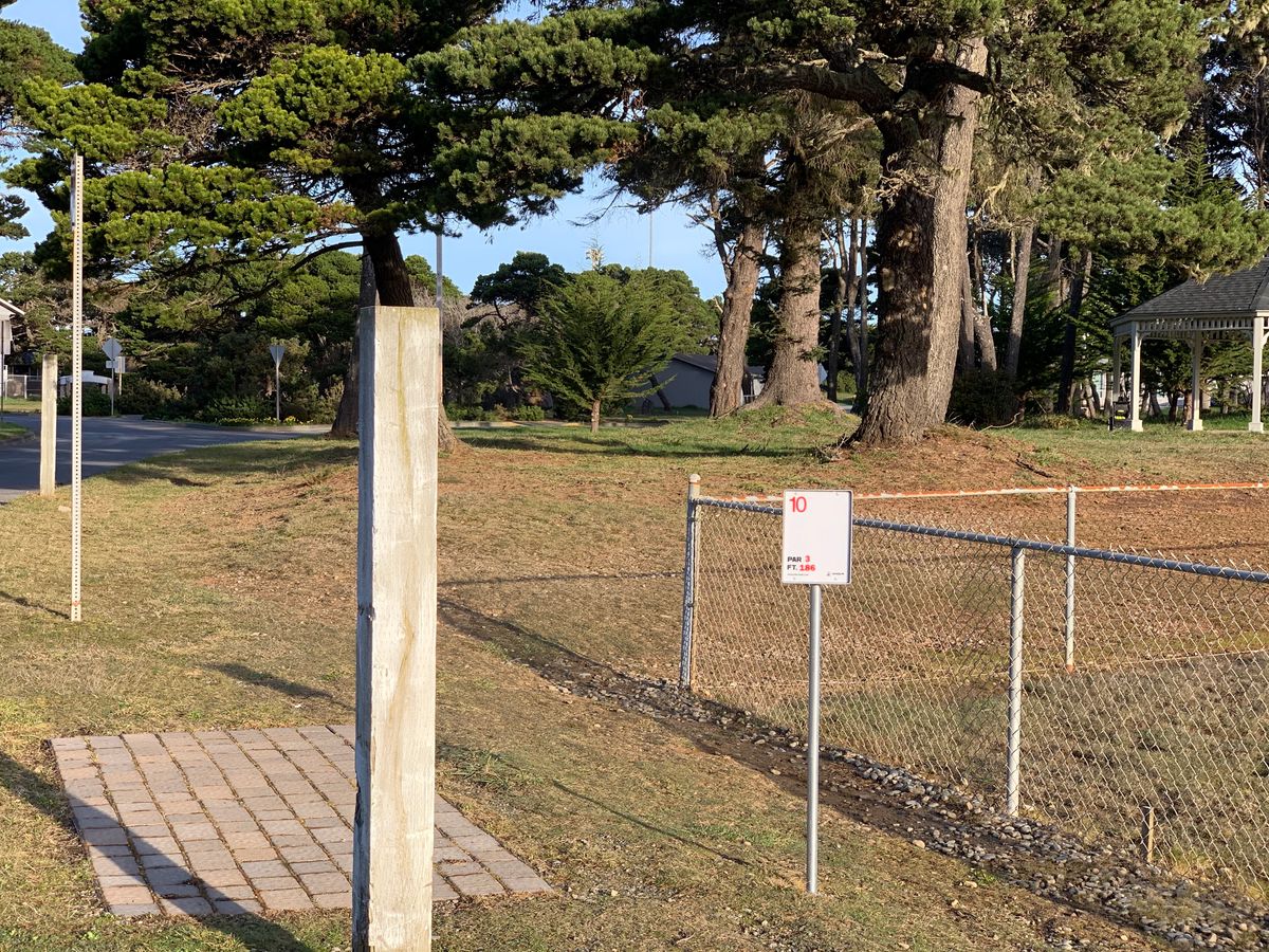 Tee pad for hole 10, past the baseball field, before the road.