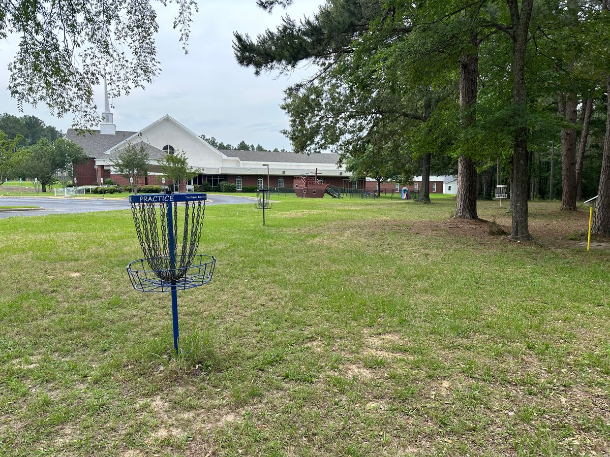 Practice baskets by the front of the church (near tee pad 1 & 10)
