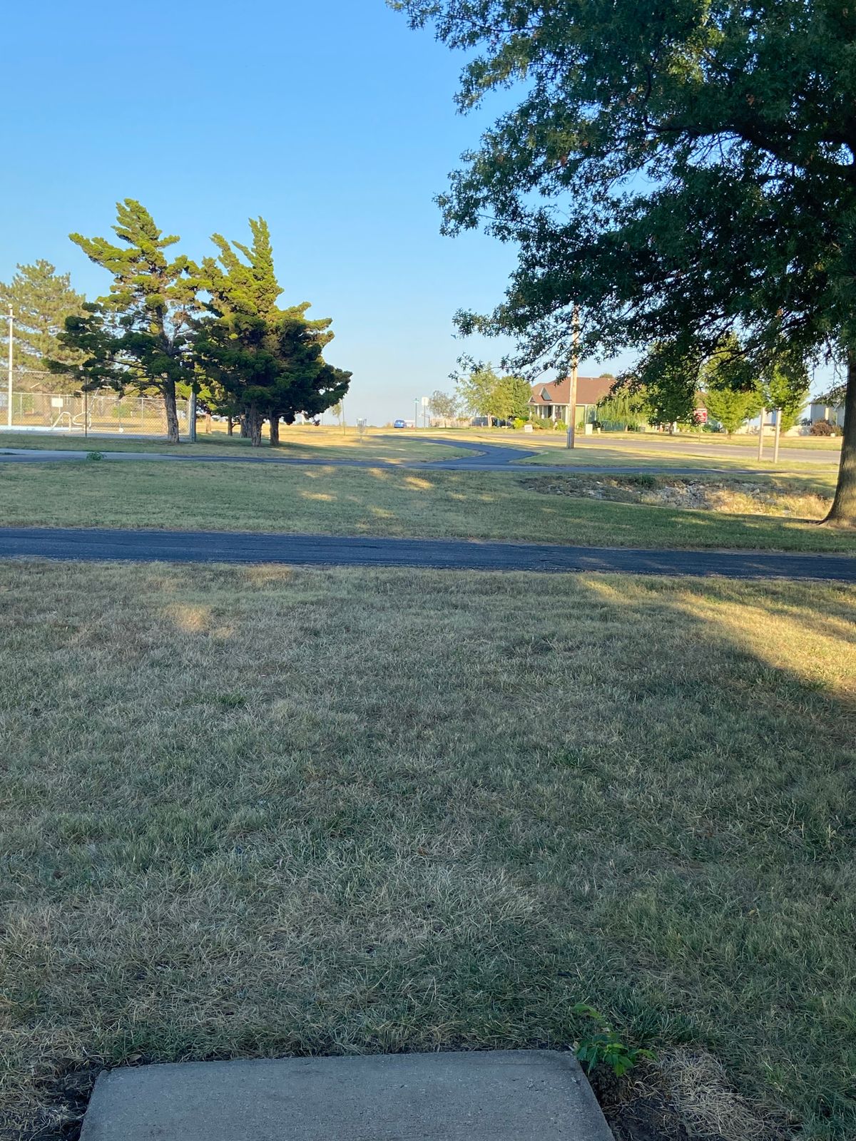 Hole 7 - walking paths play as a river, road on the right and pool on the left are both OB
