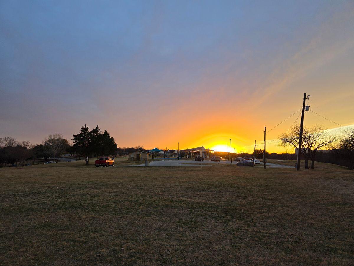 Hole 18 fairway looking right toward playground at sunset