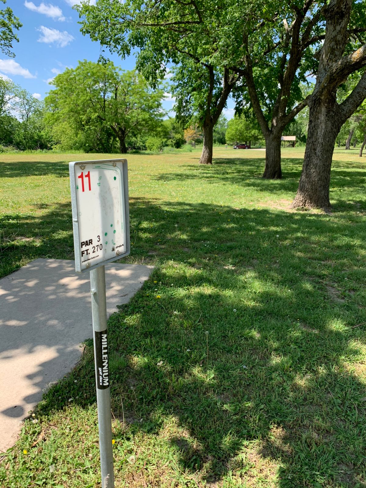 11 fairway from tee pad. Water on left and behind basket should not be in play.
