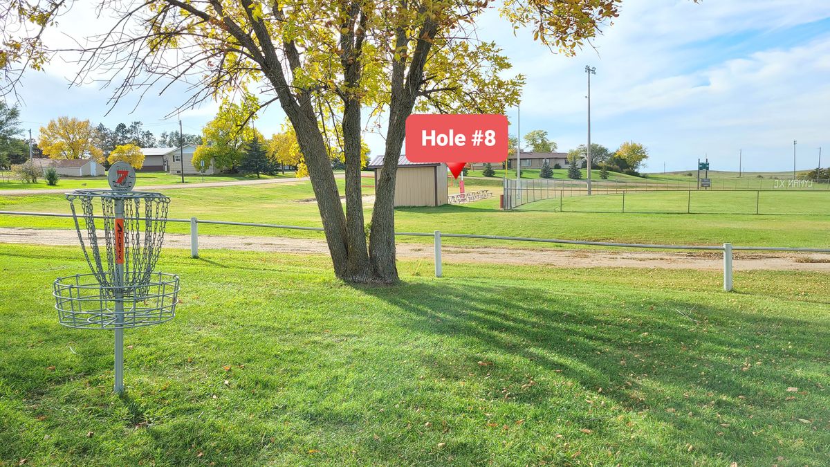Hole 8 is a longer throw over a sand volleyball court.