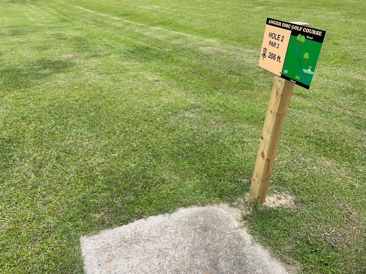 The new signs literally obstruct your throw, they were placed right on top of the tee pad