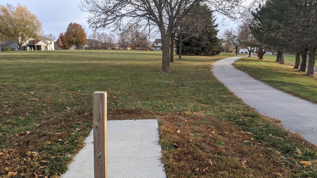 Tee #6. (Basket past three trees in front/left of pine)