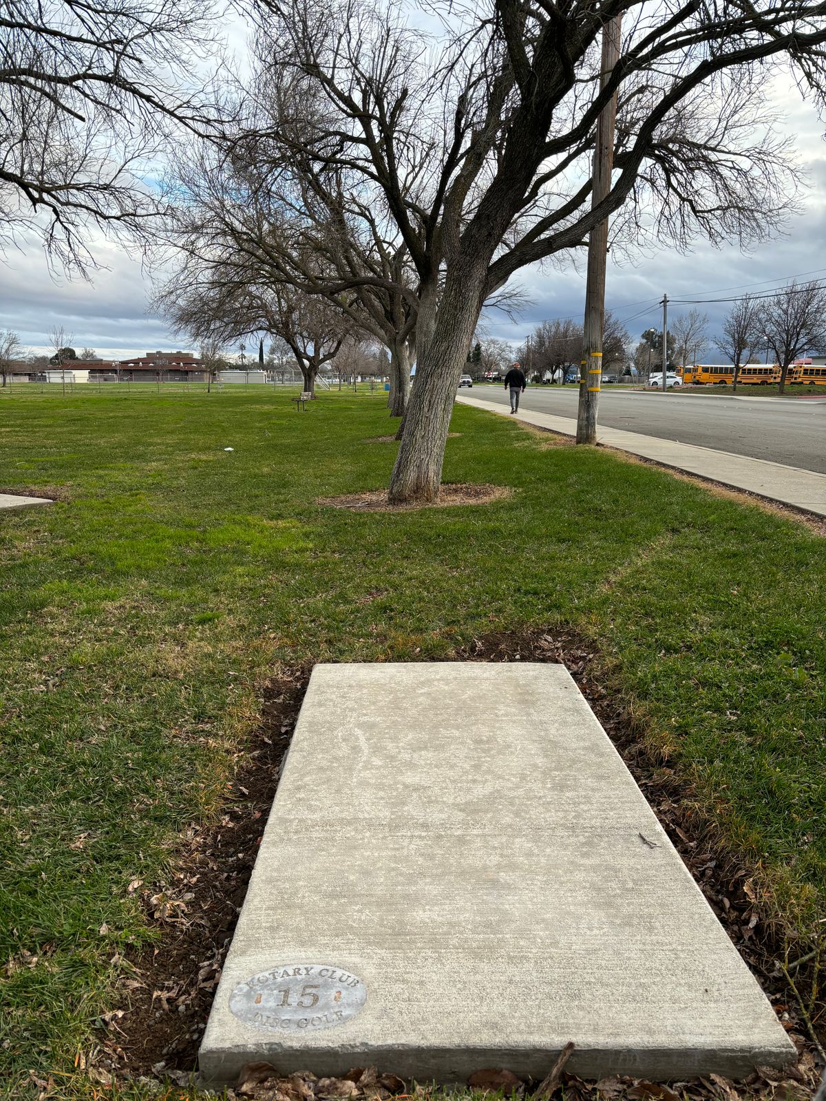 15 tee pad.  On the sidewalk or street is all OB.