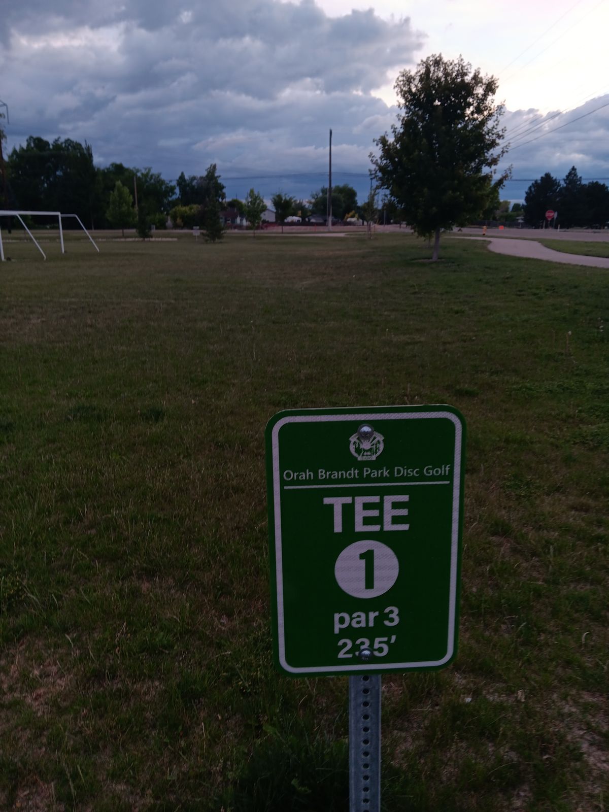 Hole 1 on the front right corner when you pull into the park.   Public bathrooms you can use near the playground and water park.