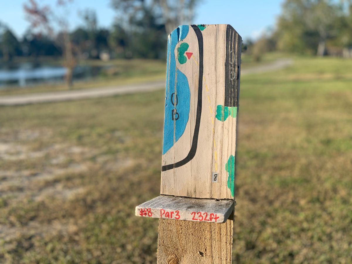Each tee pad has a hand painted sign.
