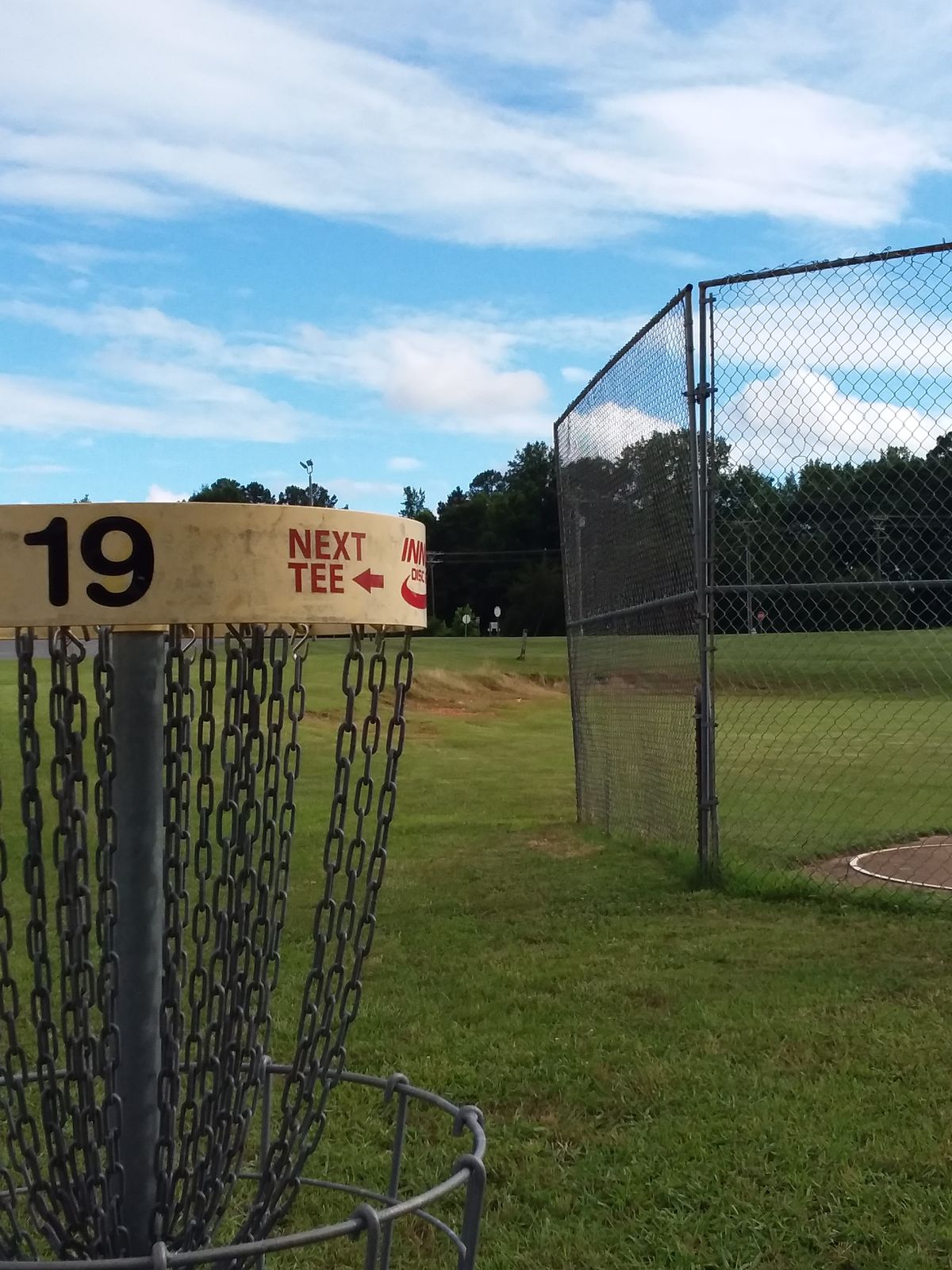Downhill tee shot with "frontstop" as an interesting obstacle.