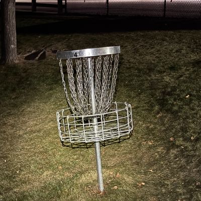 Hole 4’s basket on a hill nearby the basketball courts.
