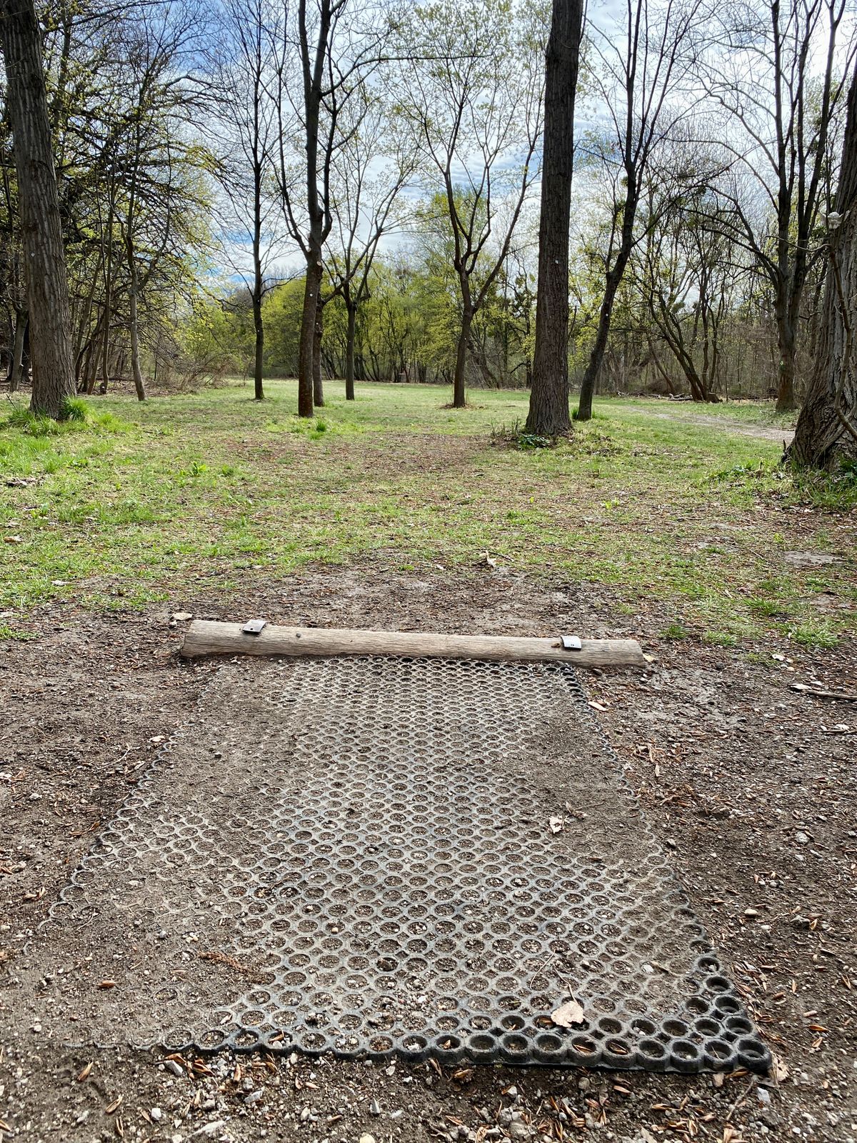 Some of the teepads have this rubber mat, which helps, but isn’t as good as concrete. Hole 8