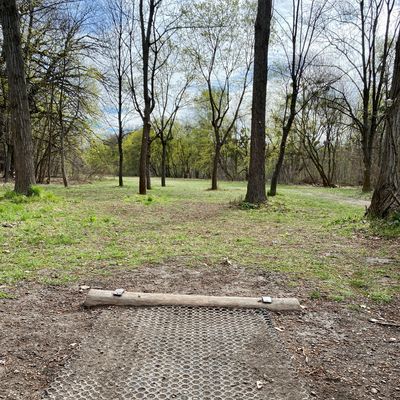 Some of the teepads have this rubber mat, which helps, but isn’t as good as concrete. Hole 8