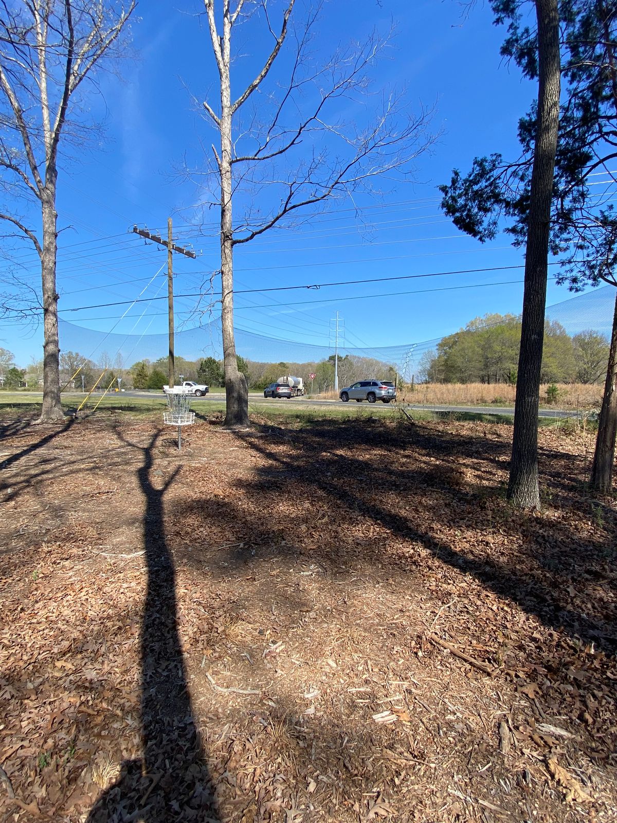 Netting behind hole 1’s green to protect the road