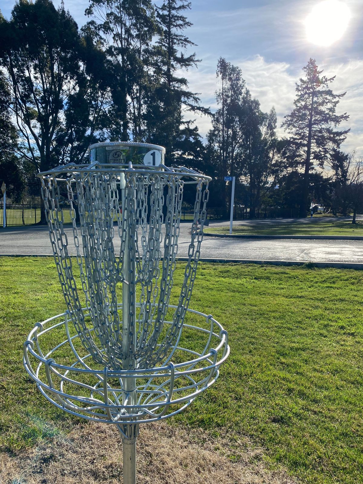 Hole 1 basket in the sun