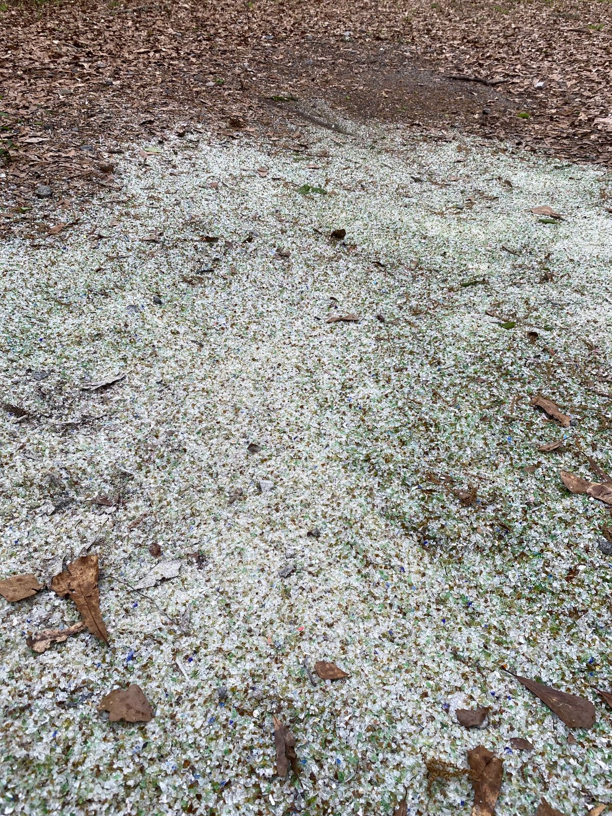 Crushed glass tee pad. Odd but not bad.