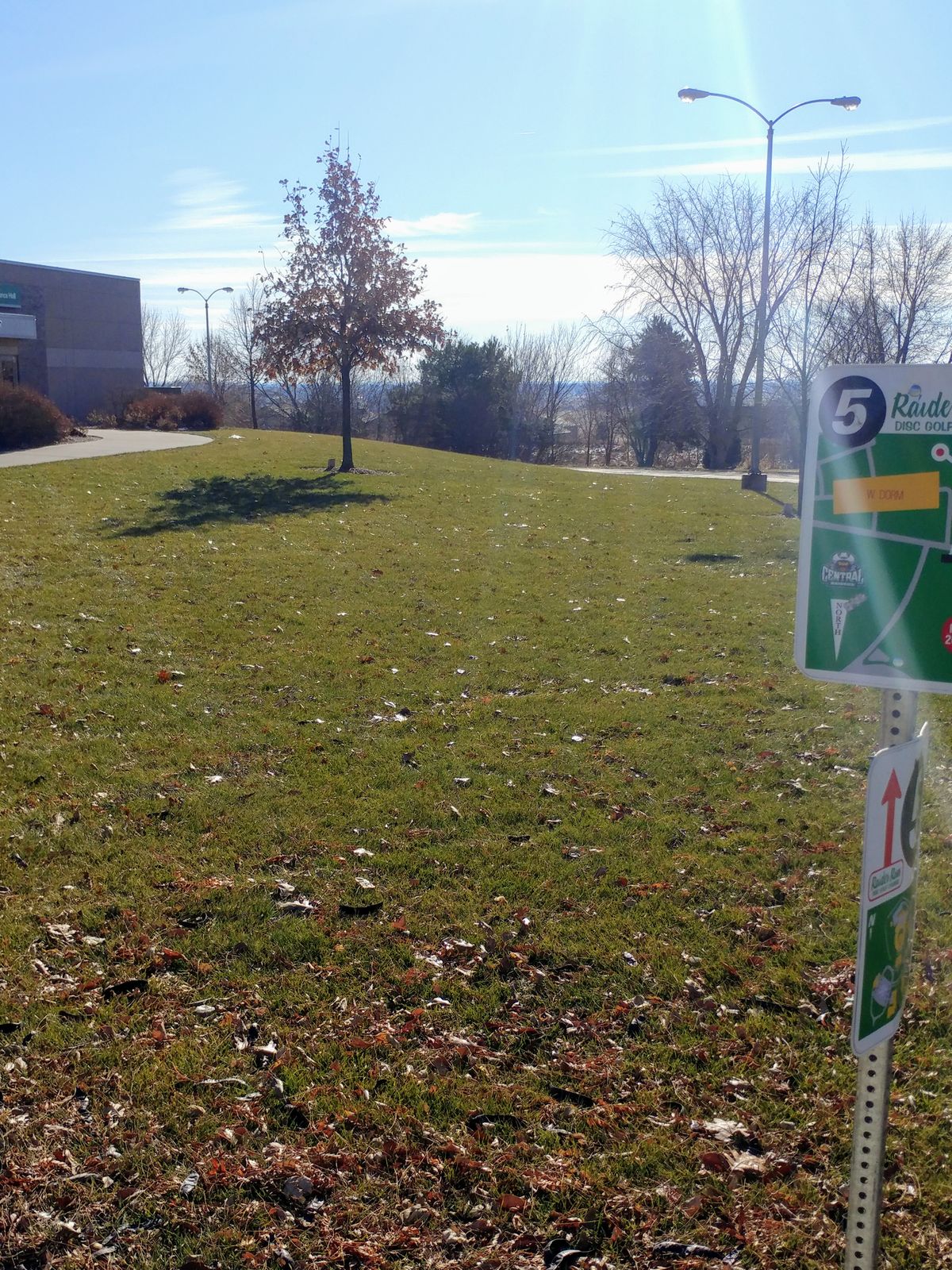 Hole #5. Hole is just around the corner of the building.