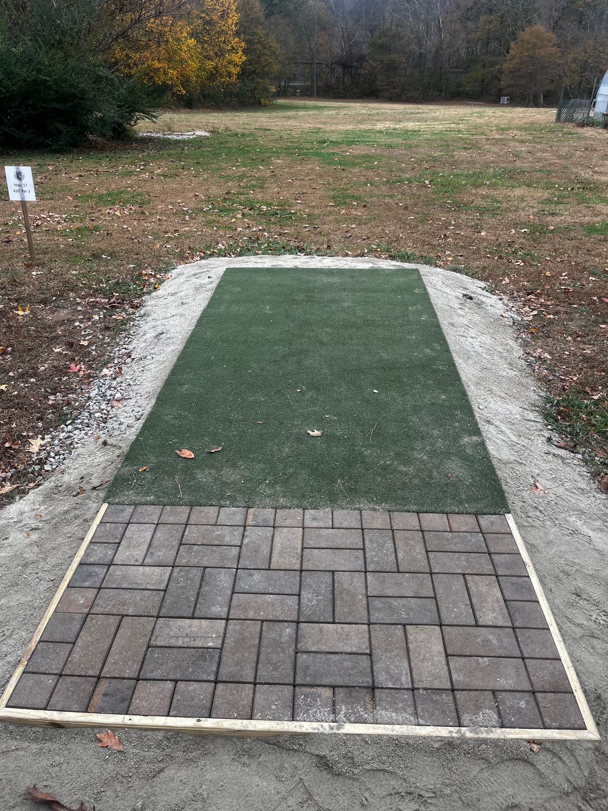 Hole 17 tee pad with turf and paver extension