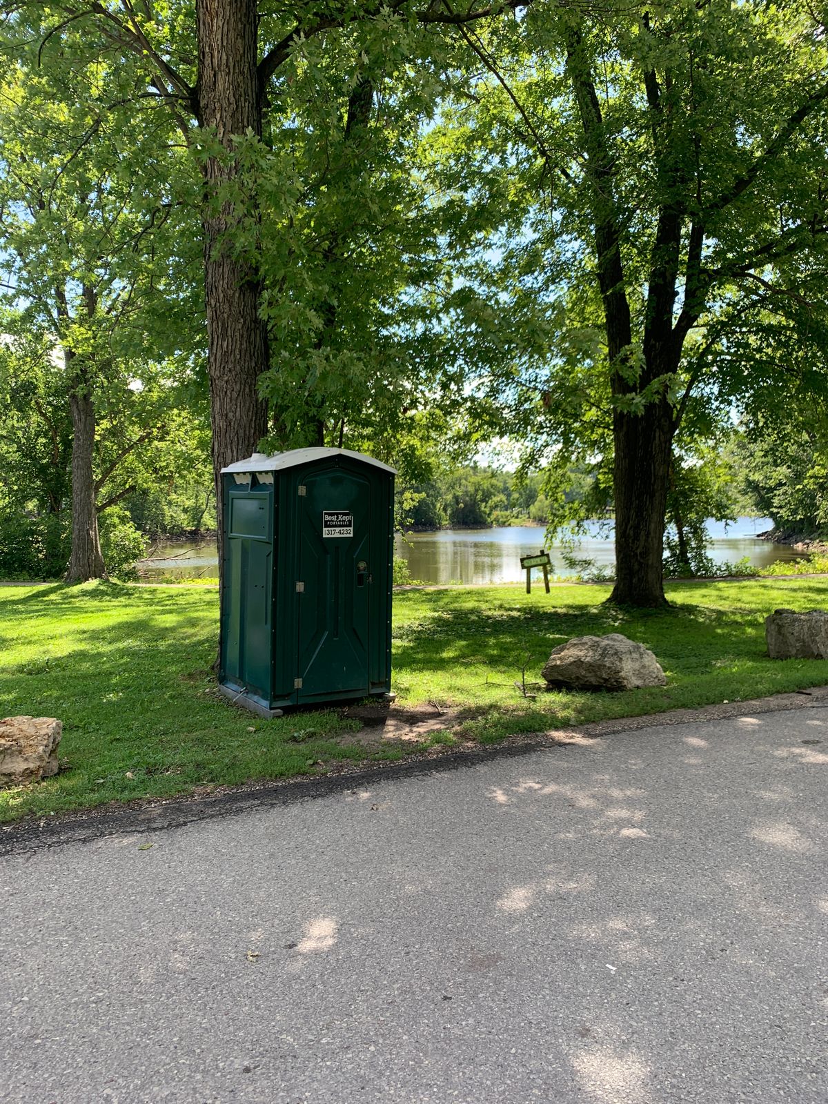 Single bathroom located directly south of parking lot