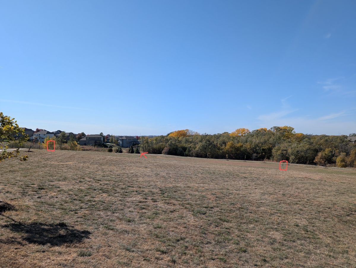 Hole #1 on the left, hole #2 on the right, arrow pointing in the direction of hole #3 in the middle.