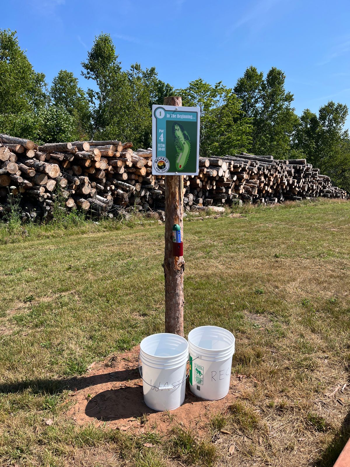 Hole 1. All the tees have recycling and garbage as well as bug spray!