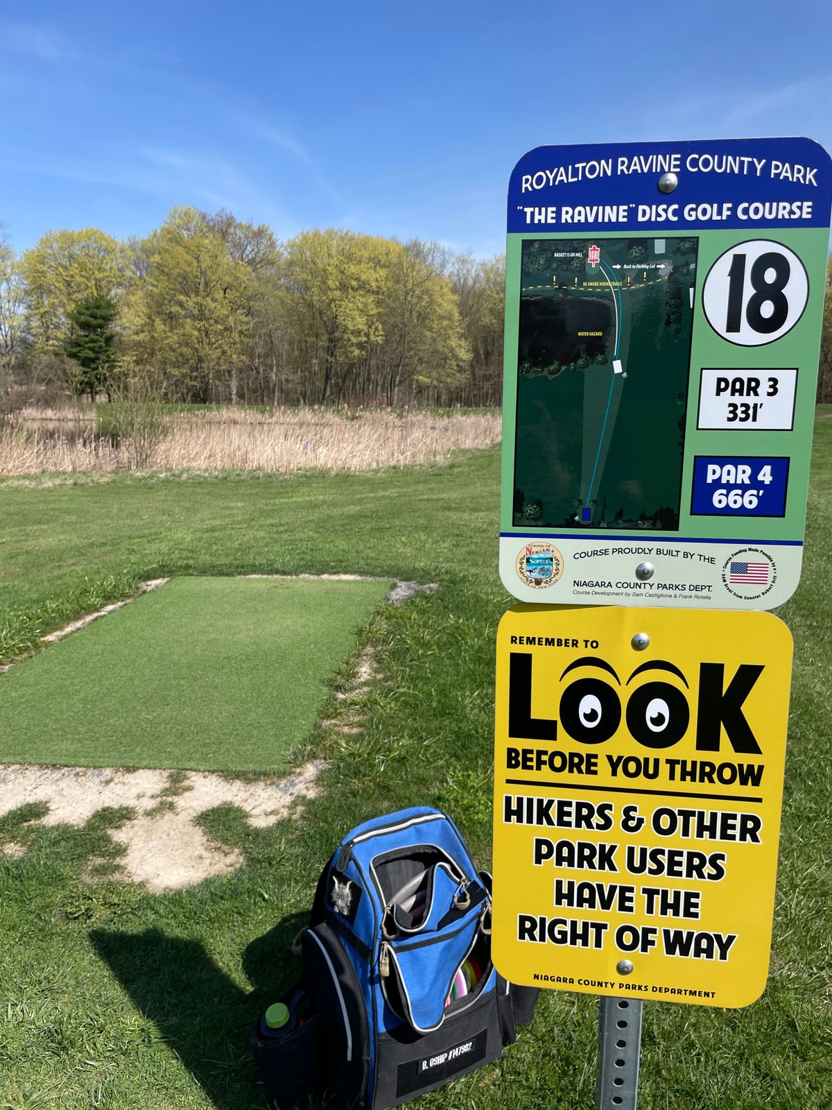 Hole 18, white tees.