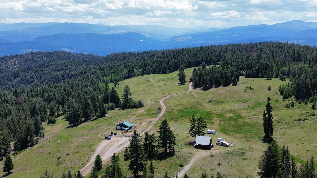 Parking lot, club house, and outhouses