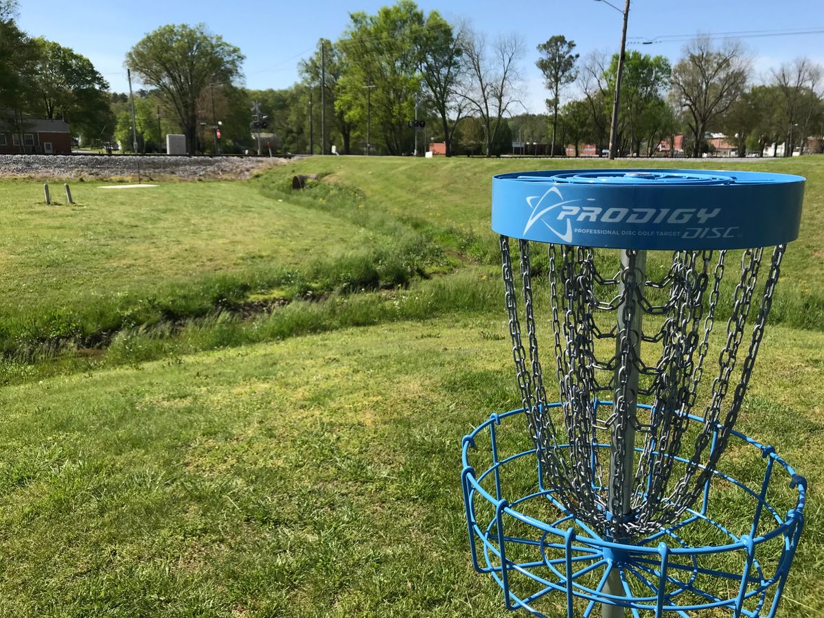 No. 12 basket. Next tee back across road going toward No. 6 basket. Be careful of traffic.