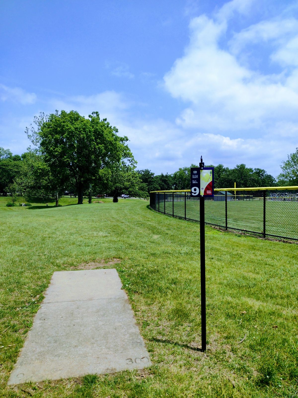 Pin #9 is a Par 4 at 300 feet. The new baseball diamond fence is a little more of a throwing hazard especially if the wind is coming in from the North West.