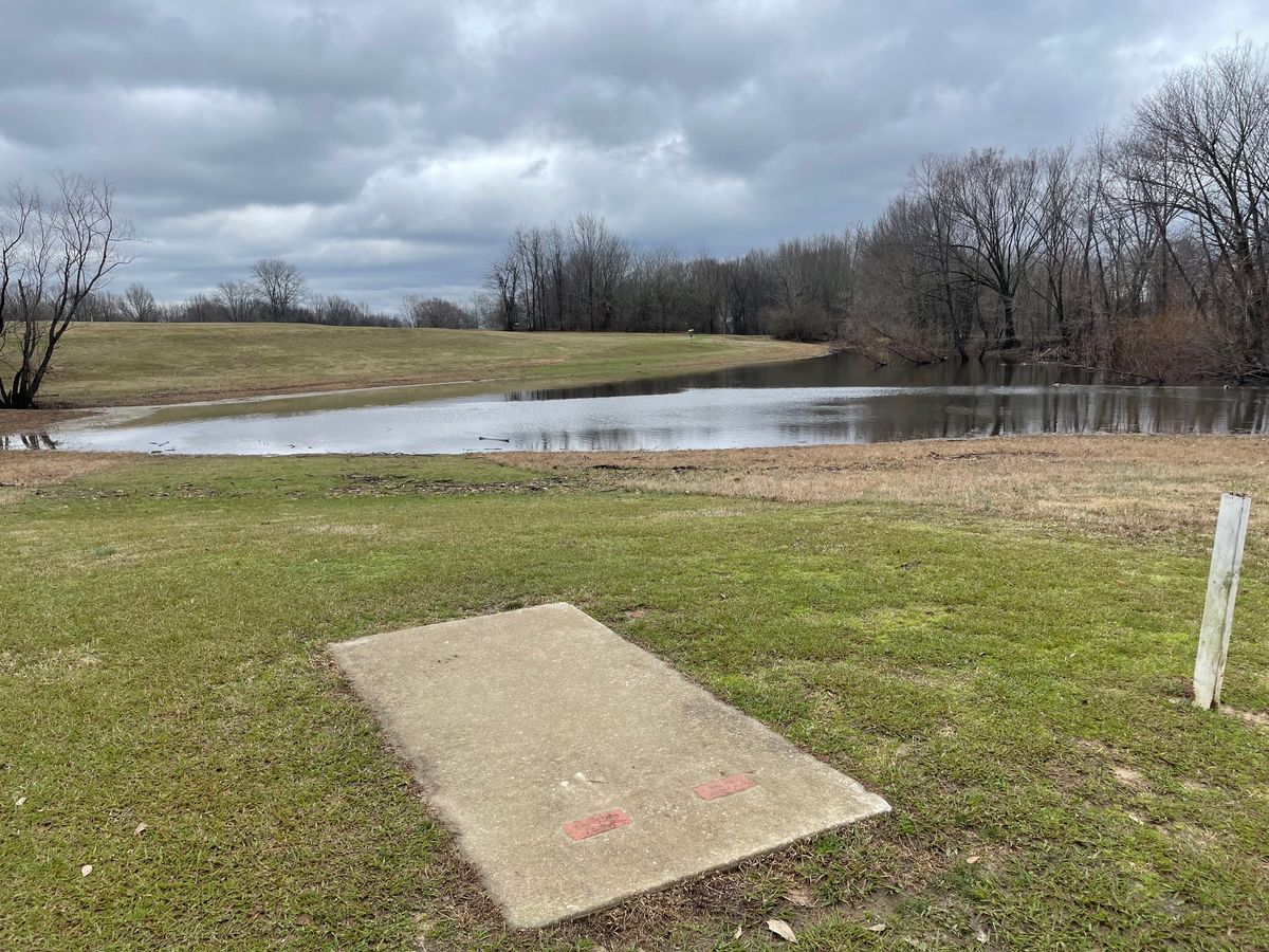 Hole 4 teepad after rain, have a path to cross over to the left of the pad.