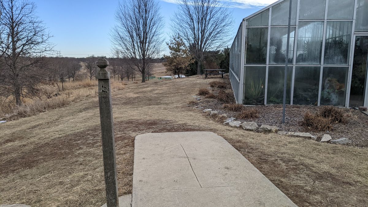 Tee #1 basket around conservatory to the right