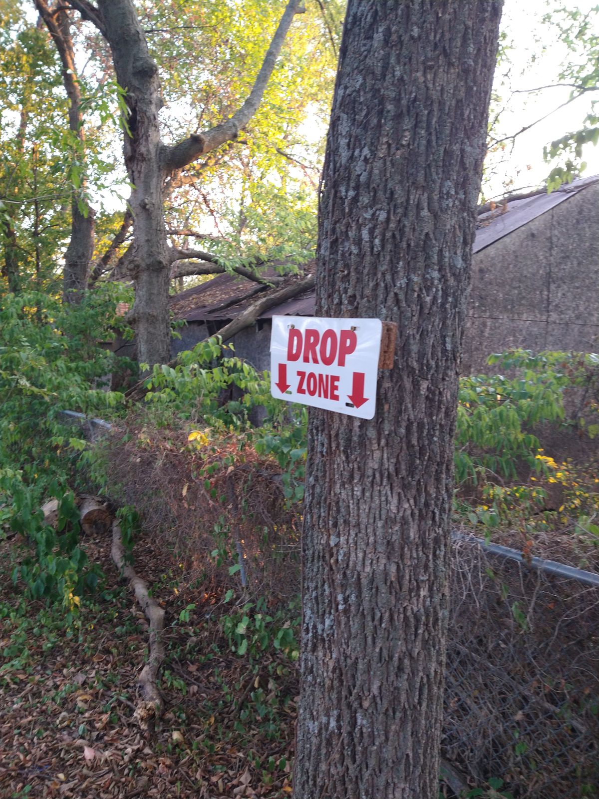 Sign on the tree marking Drop Zone for hole 2.