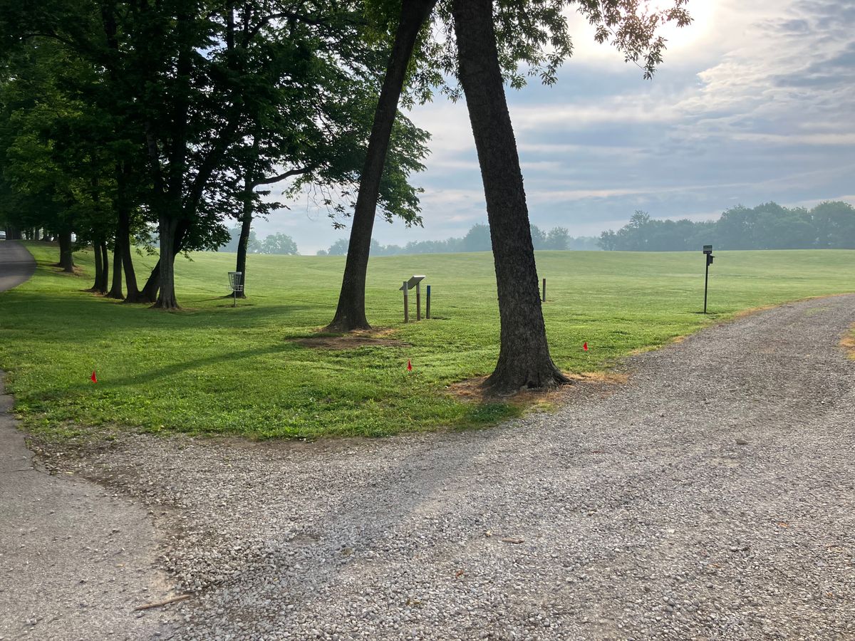 Practice basket and Course Map right off the parking lot. Hole is 200’ to the right.