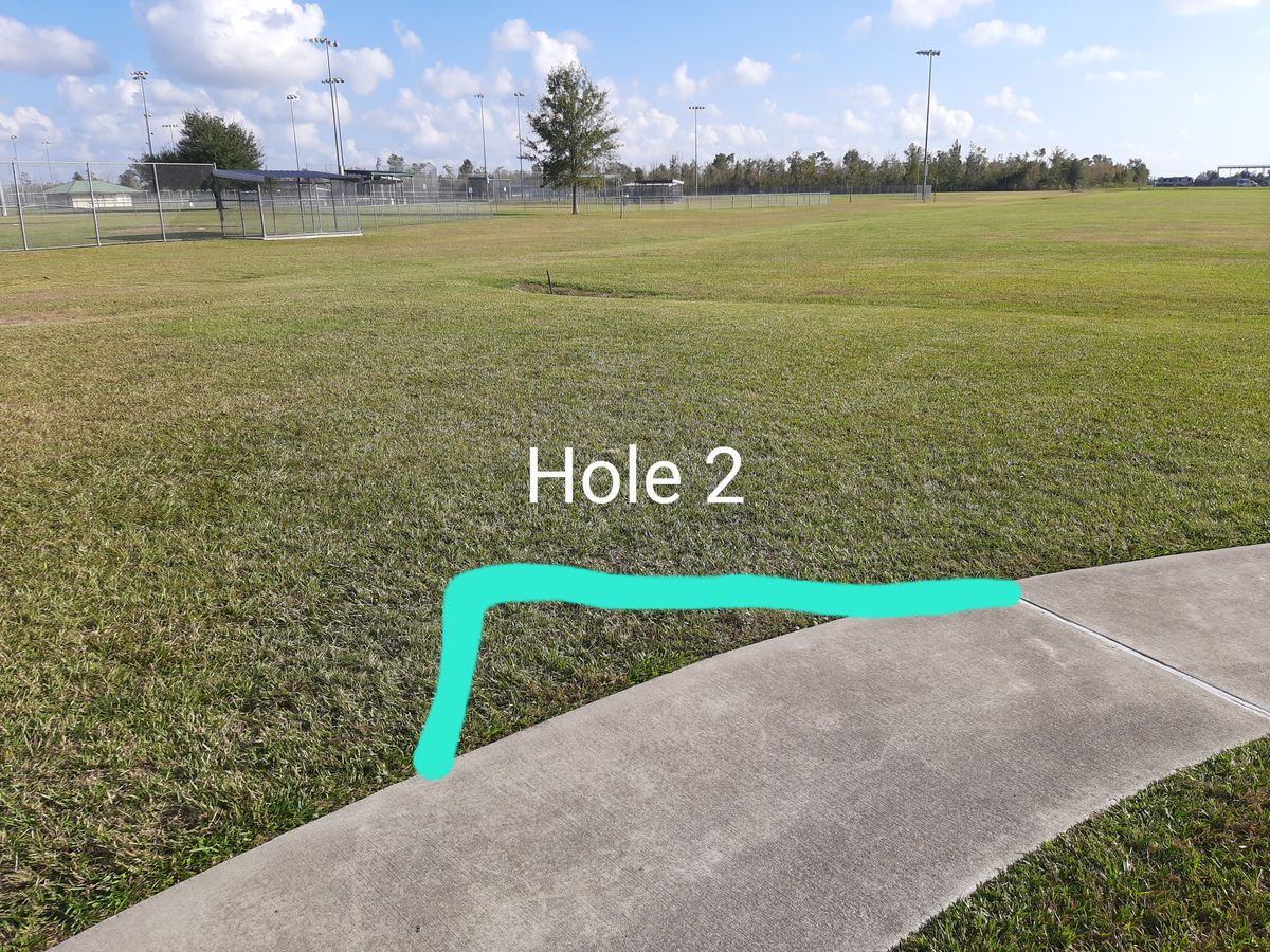Teepad is last straight section of sidewalk. Base field is OB