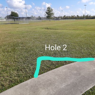 Teepad is last straight section of sidewalk. Base field is OB