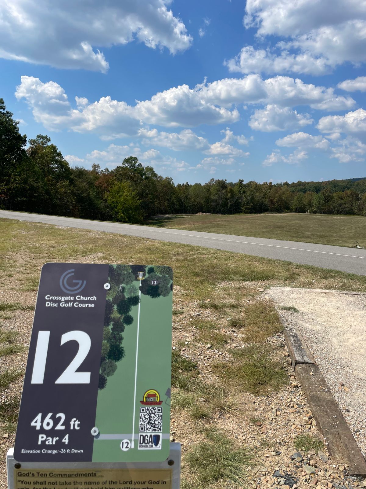 Hole 12. Basket is in the woods straight past the field.