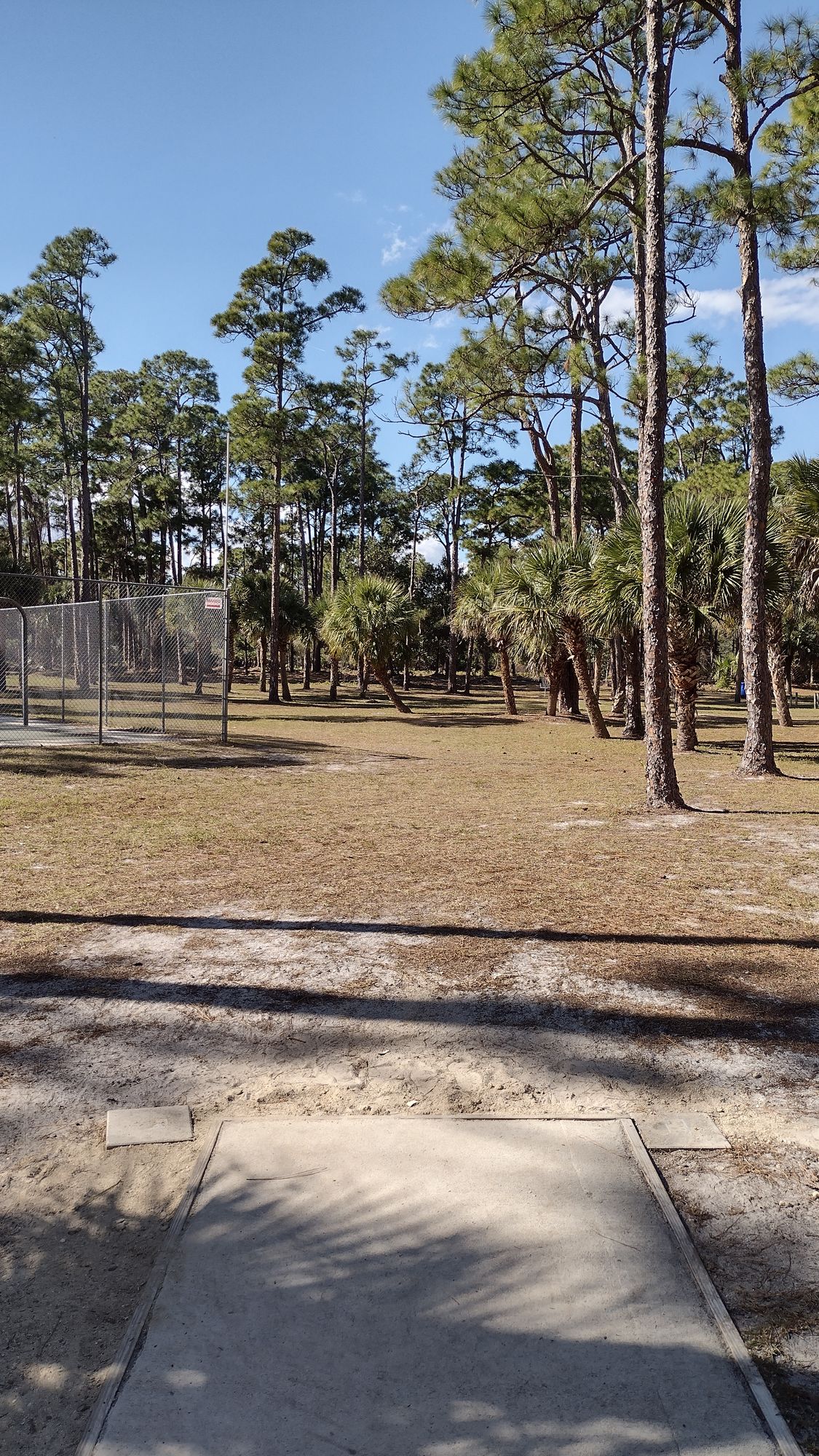 Hole 2, sidearm skip or a short airshot. Mando on left side of fairway
