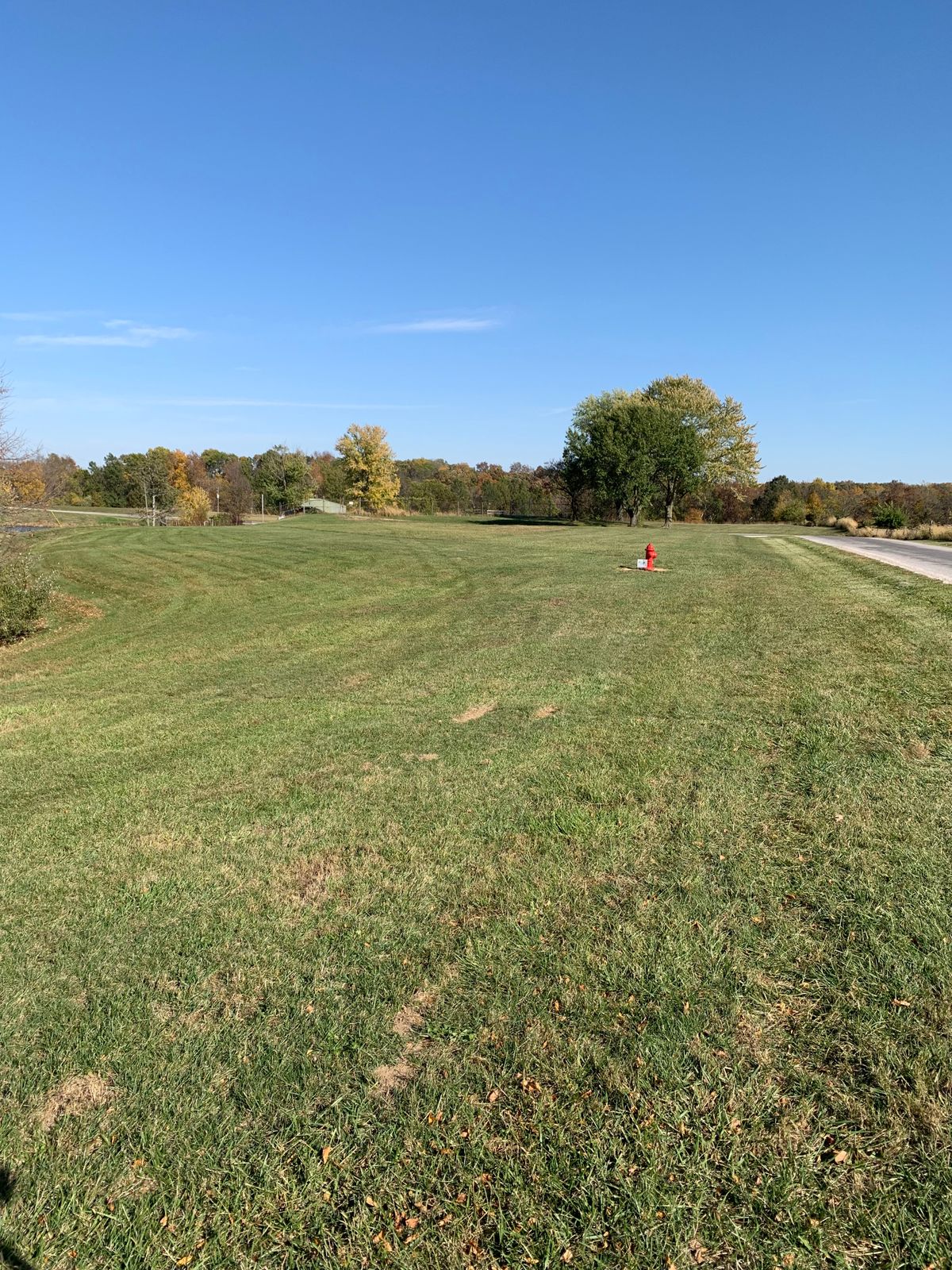 Right to left full shot to A pin on levy and B pin another 100 ft behind toward water backdrop. 