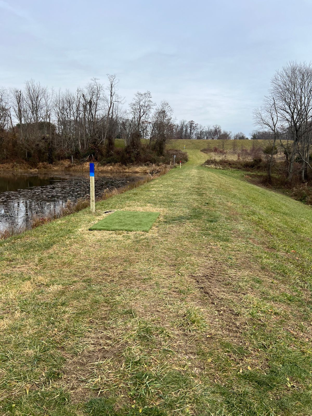Hole 1 - water hazard left and woods right with plenty of open space but narrow uphill approach.