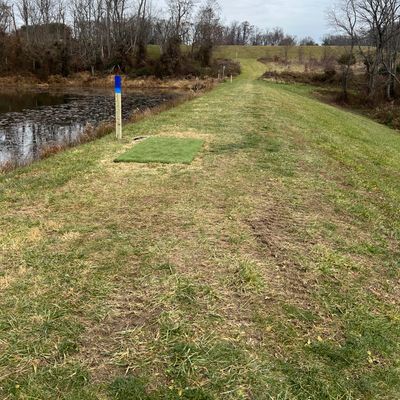 Hole 1 - water hazard left and woods right with plenty of open space but narrow uphill approach.