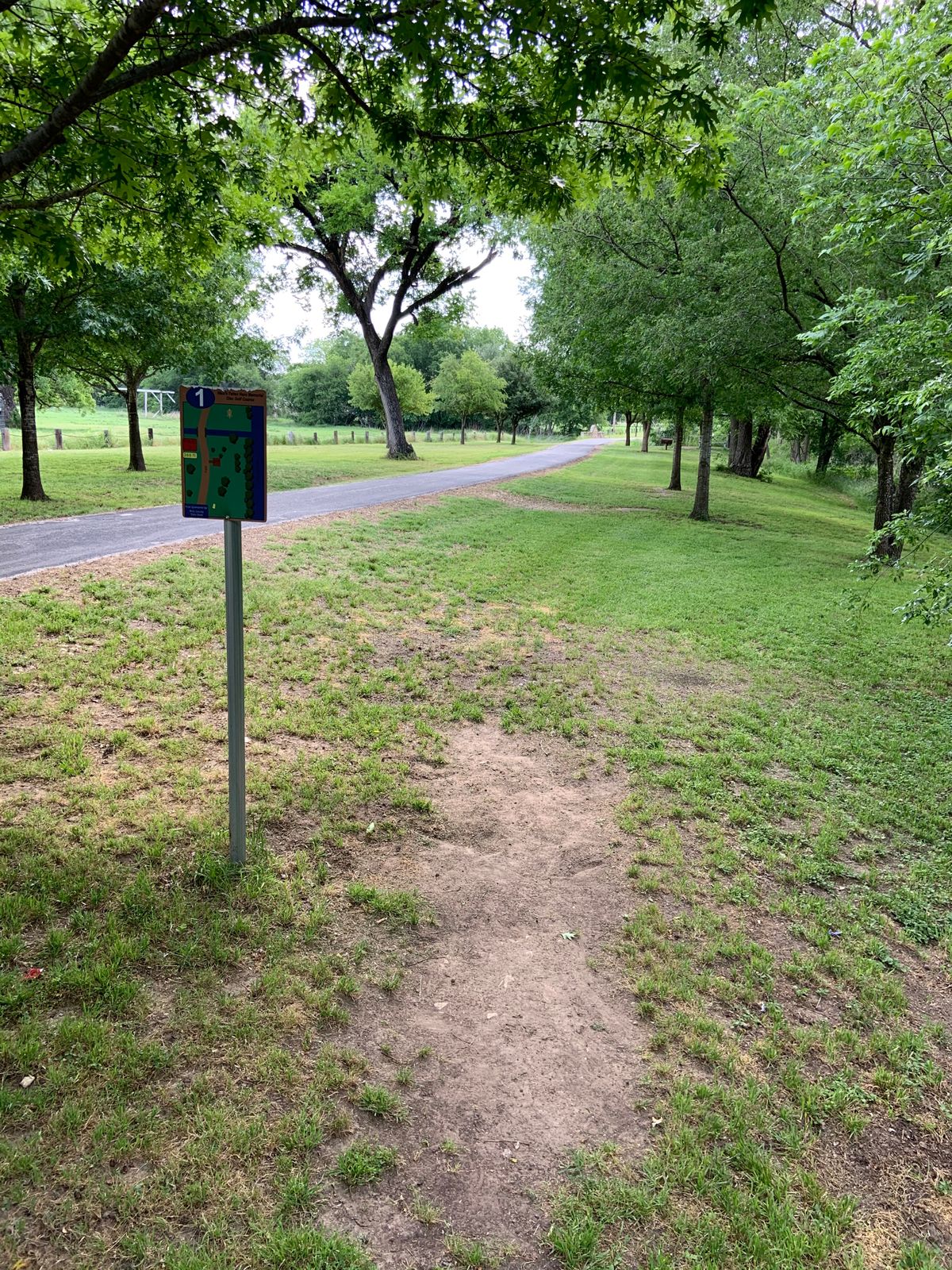 Hole 1 tee pad. Throw over path or go in river.