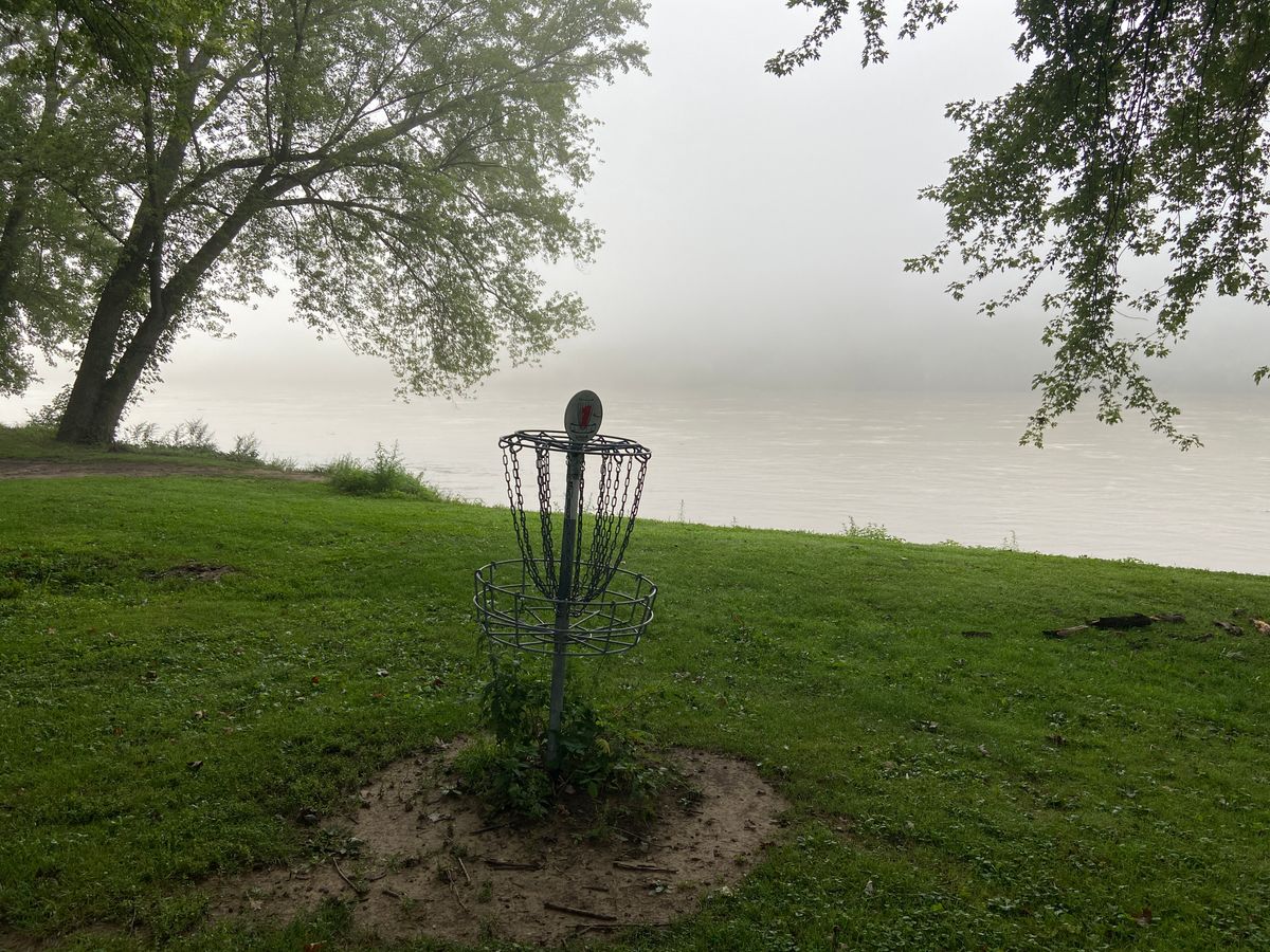 Hole #1 basket with view of river
