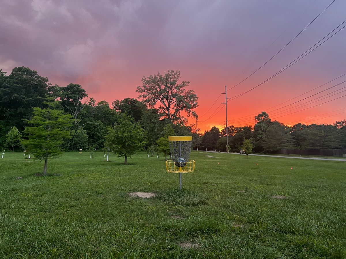 The green of hole 17 with a nice storm and sunset