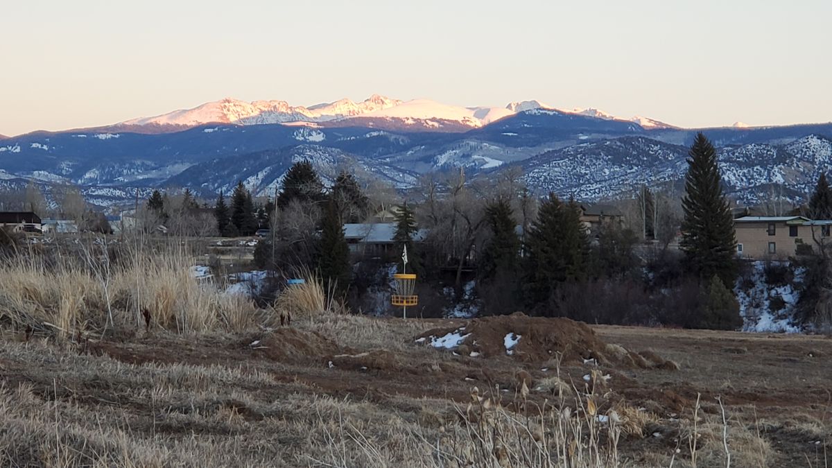Hole #7 with sawatch range in backdrop.