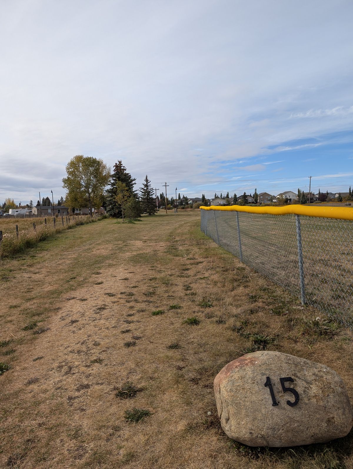 Hole 15. Along the backside of the other ball diamond towards the road.