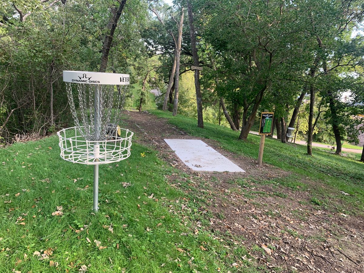 Hole 1 basket near hole 3 teepad.