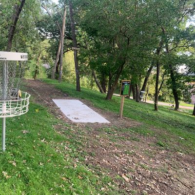 Hole 1 basket near hole 3 teepad.