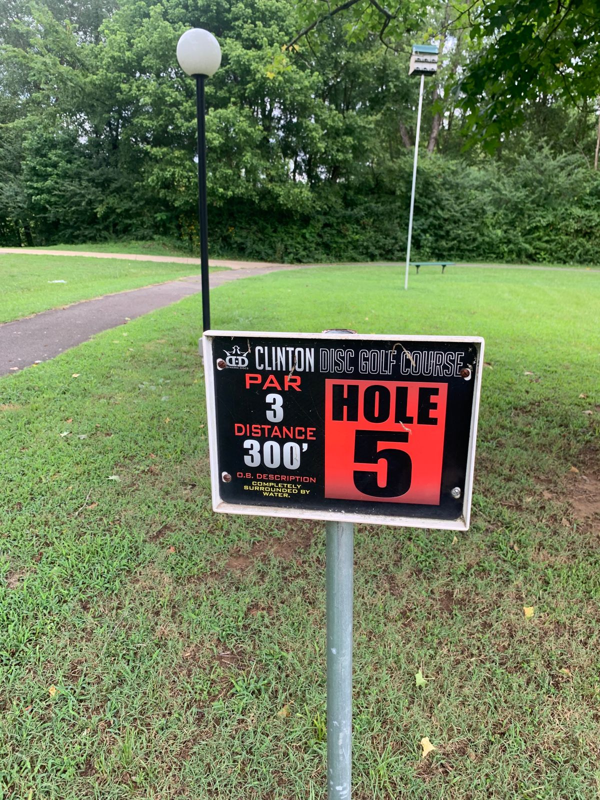 Hole 5 has pond on right side and woods/river on left