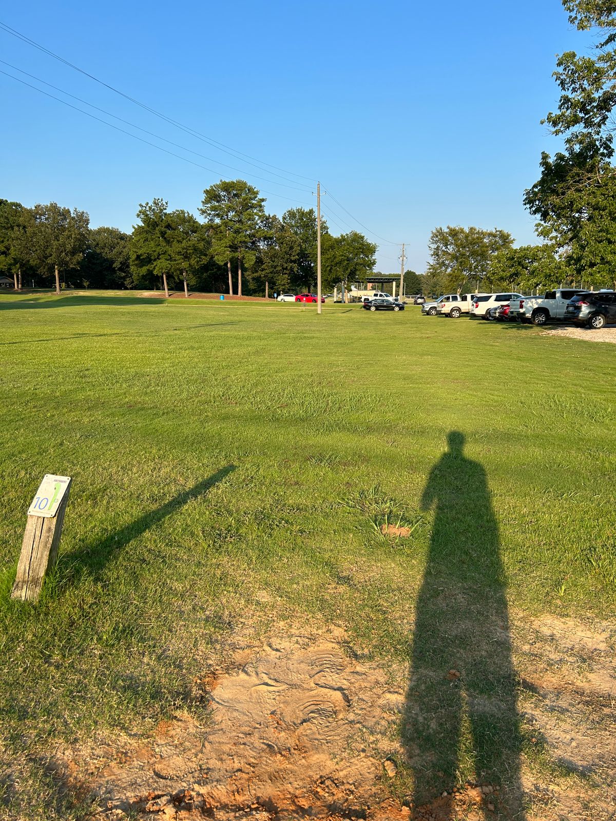 Hole 10 straight ahead, cars were parked along the right side fairway due to kids soccer practice