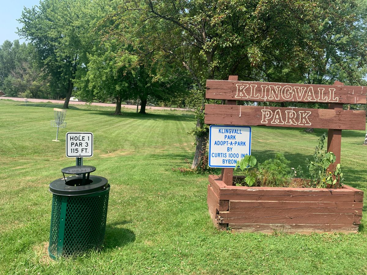 View of park sign & hole 1 teepad.