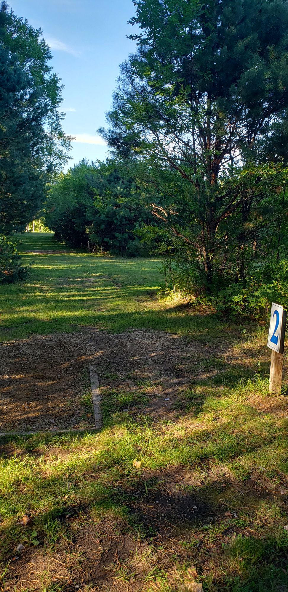 Hole 2 long tee, long corridor with basket to the right after the clearing.